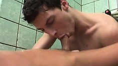 In the shower, a hot brunette cocksucker takes a hard dick up his butt